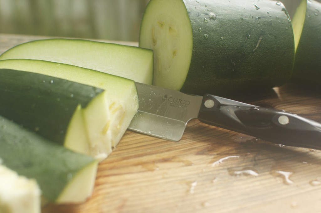 Slicing zucchini with cutco chef knife www.cubitsorganics.com